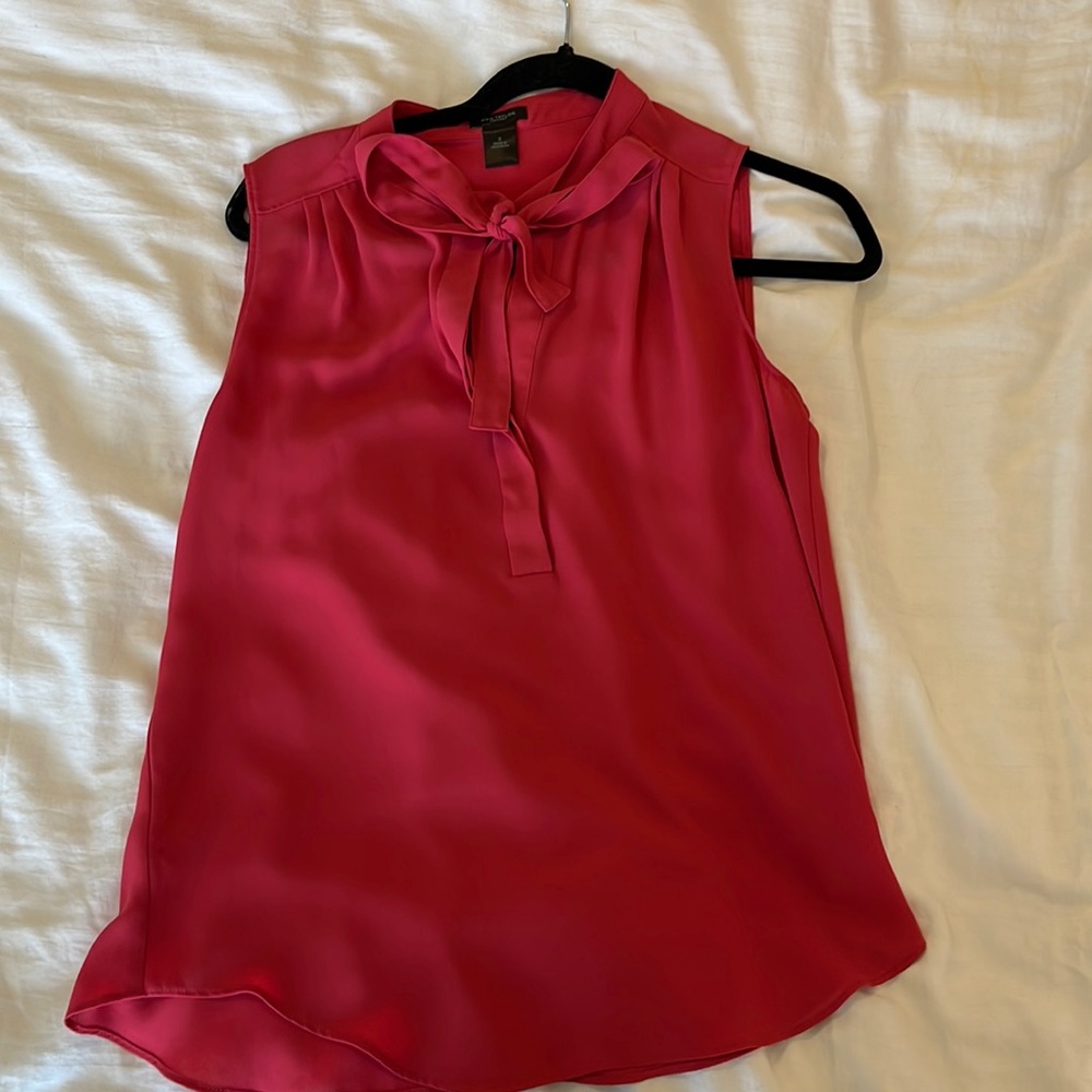 Sleeveless pink bow blouse